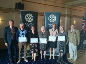 Left to right Robert Dunn, club president; Ricky McKell, Eagles Wings; Frances Parry, Cornerstone; Katrina Saunders, Cairn Fowk; Judy McGreal, Brae Riding; Tina Brown (for Linda Falconer), Dundee Food Bank, and John Irvine, club community service convener